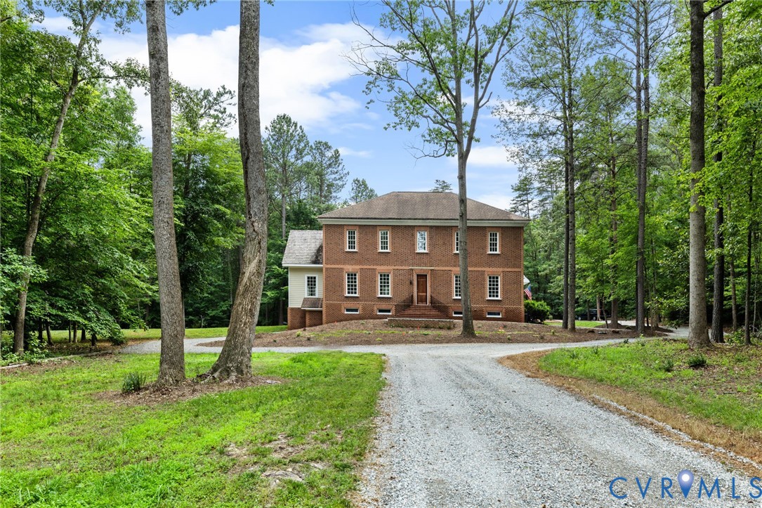 13173 Scotchtown Road Beaverdam, VA 23015 - Photo 61 of 65 a front view of a house with a yard and trees
