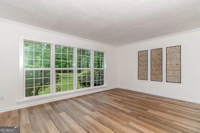 a kitchen with a refrigerator stove top oven and sink