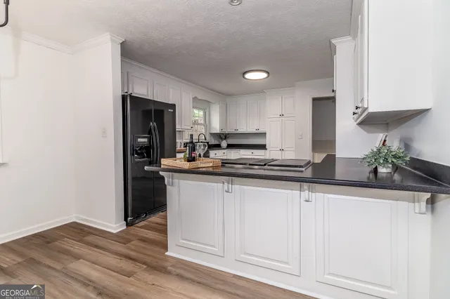 a view of balcony with wooden floor and fence