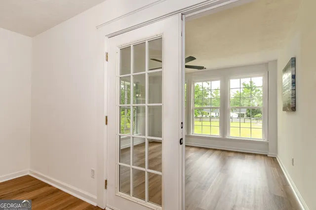 a view of room with window and air conditioner