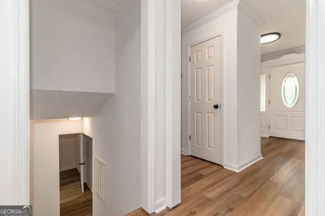 an aerial view of residential house with outdoor space and trees all around