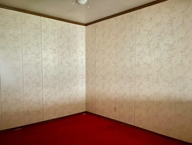 a stove top oven sitting inside of a kitchen
