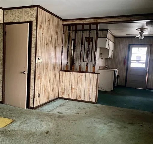 a view of a closet with wooden floor