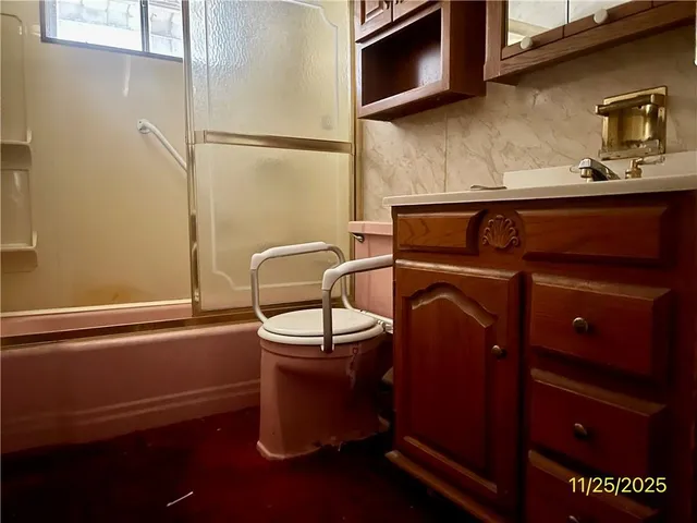 a bathroom with a toilet and a sink
