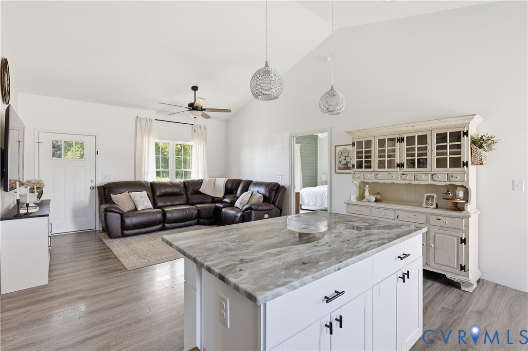 235 Stoney Point Road Cumberland, VA 23040 - Photo 20 of 35 a view of center island of kitchen with granite countertop living room