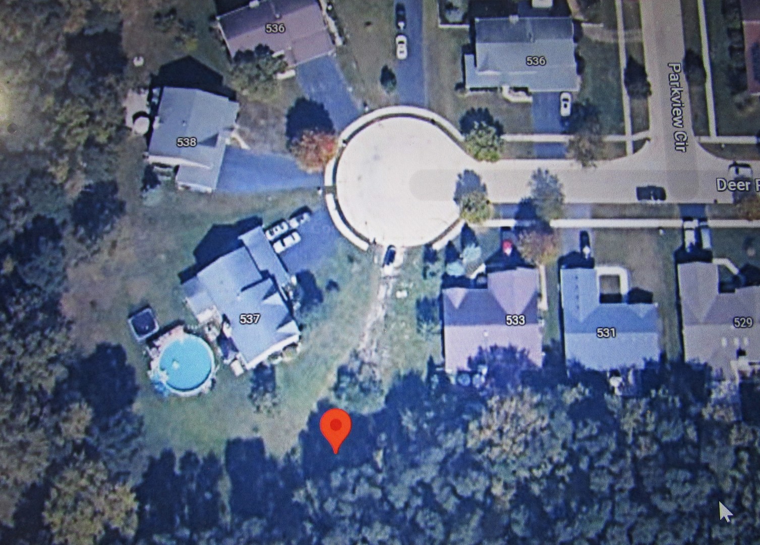 an aerial view of a house with garden space sitting space and swimming pool