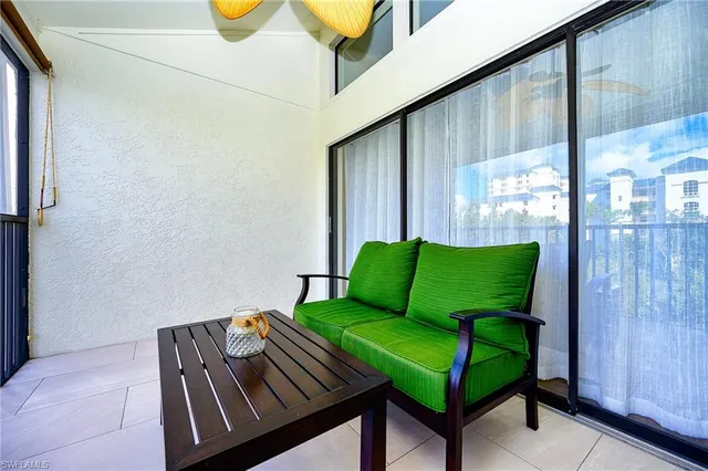 a view of a balcony with chairs