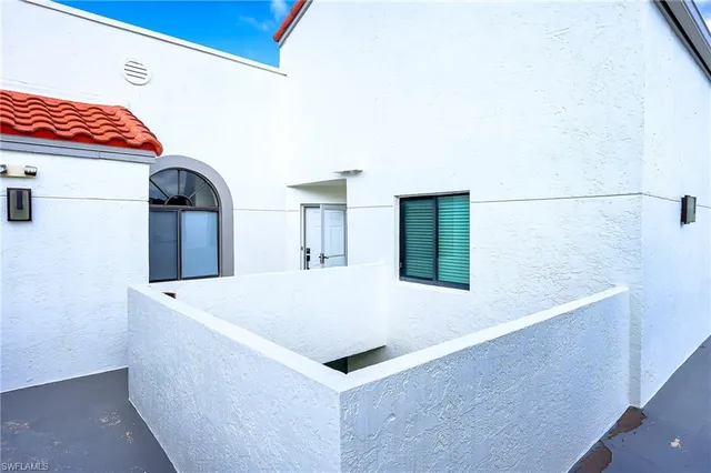 a kitchen with a white cabinets and white appliances