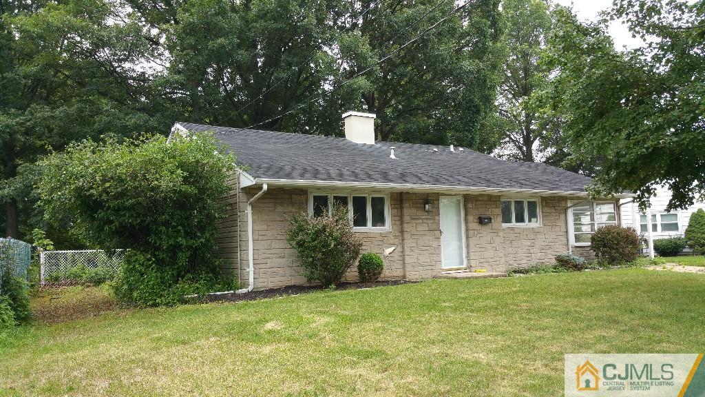 125 Winthrop Road Edison, NJ 08817 - Photo 1 of 23 a front view of a house with a garden and plants