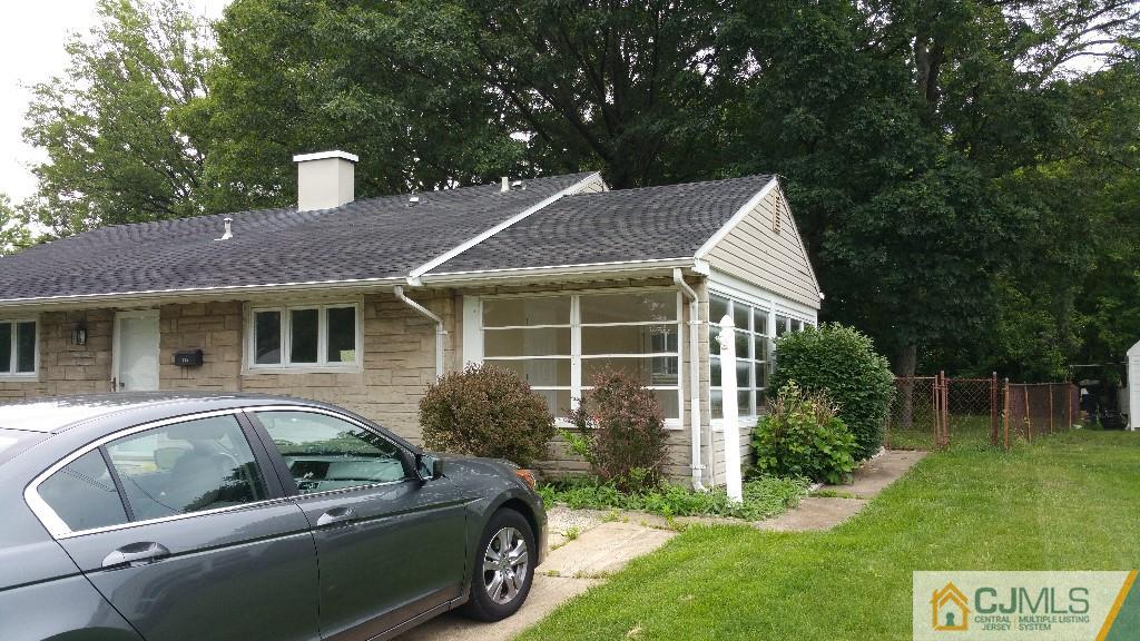 125 Winthrop Road Edison, NJ 08817 - Photo 2 of 23 a front view of a house with a garden