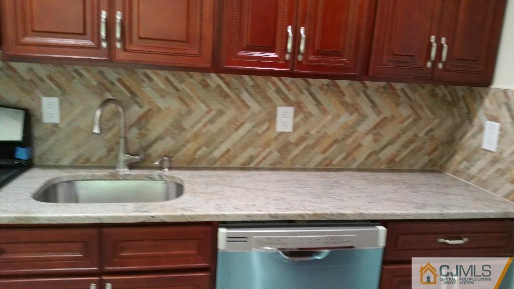 125 Winthrop Road Edison, NJ 08817 - Photo 19 of 23 a kitchen with a sink and cabinets