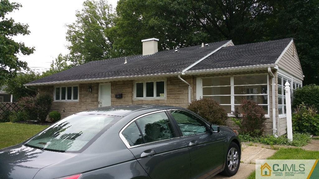 125 Winthrop Road Edison, NJ 08817 - Photo 3 of 23 a front view of a house with a garden