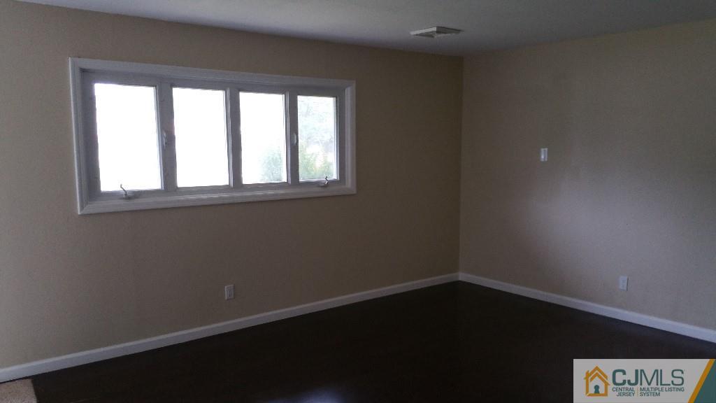 125 Winthrop Road Edison, NJ 08817 - Photo 5 of 23 an empty room with a window