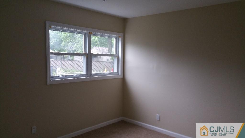 125 Winthrop Road Edison, NJ 08817 - Photo 8 of 23 an empty room with a window