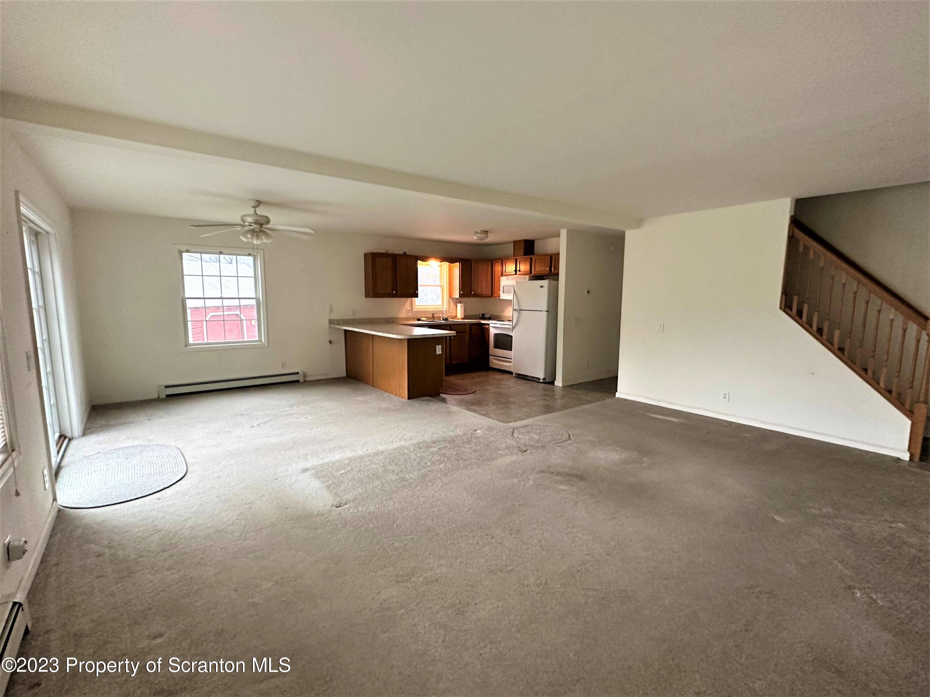 490 Bow Bridge Road Little Meadows, PA 18830 - Photo 8 of 54 a view of empty room with windows