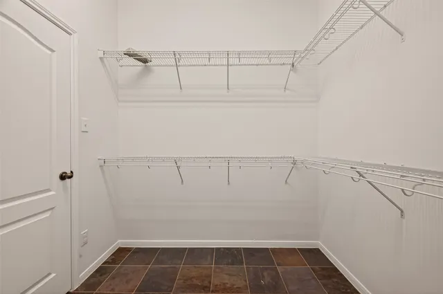 a view of an empty walk in closet