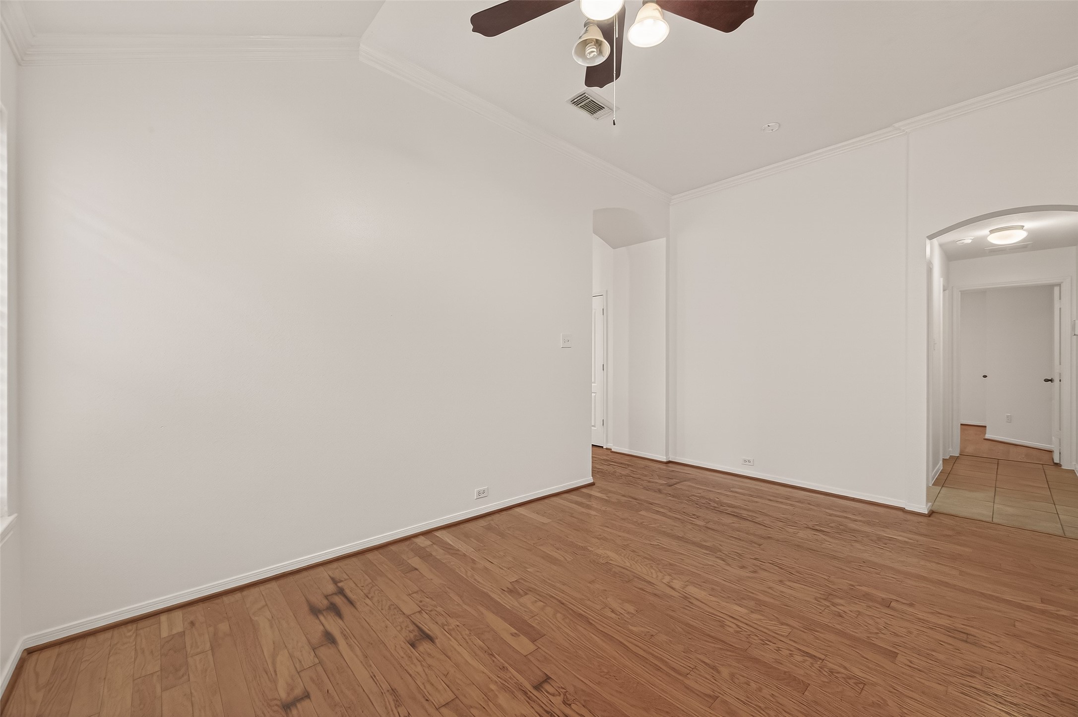 2704 Hewn Rock Way Pearland, TX 77584 - Photo 22 of 40 a view of an empty room with wooden floor