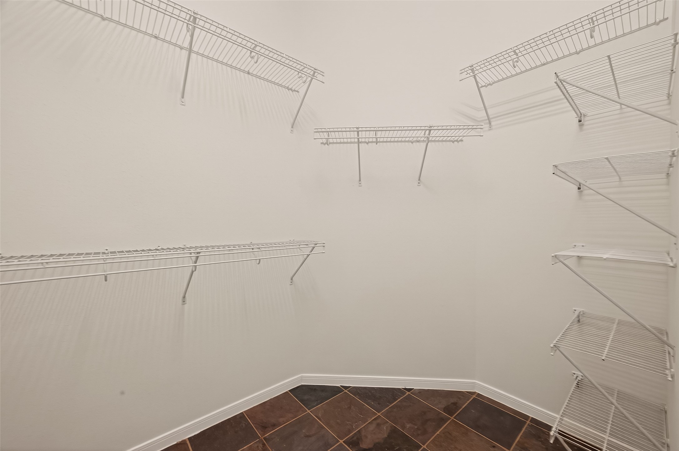 2704 Hewn Rock Way Pearland, TX 77584 - Photo 23 of 40 a view of a room with racks on the wall