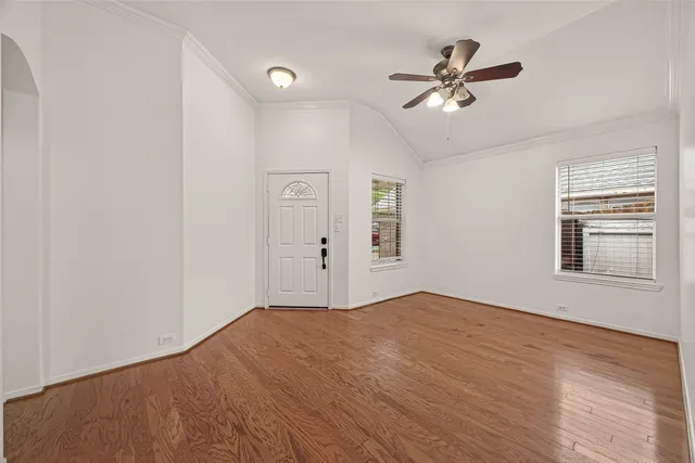 a view of an empty room with a window