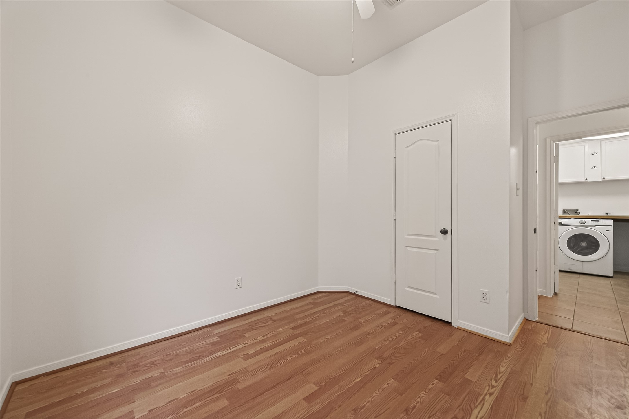 2704 Hewn Rock Way Pearland, TX 77584 - Photo 29 of 40 a view of a room with wooden floor and white doors