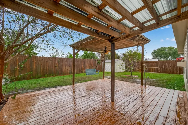 a view of a backyard with wooden floor