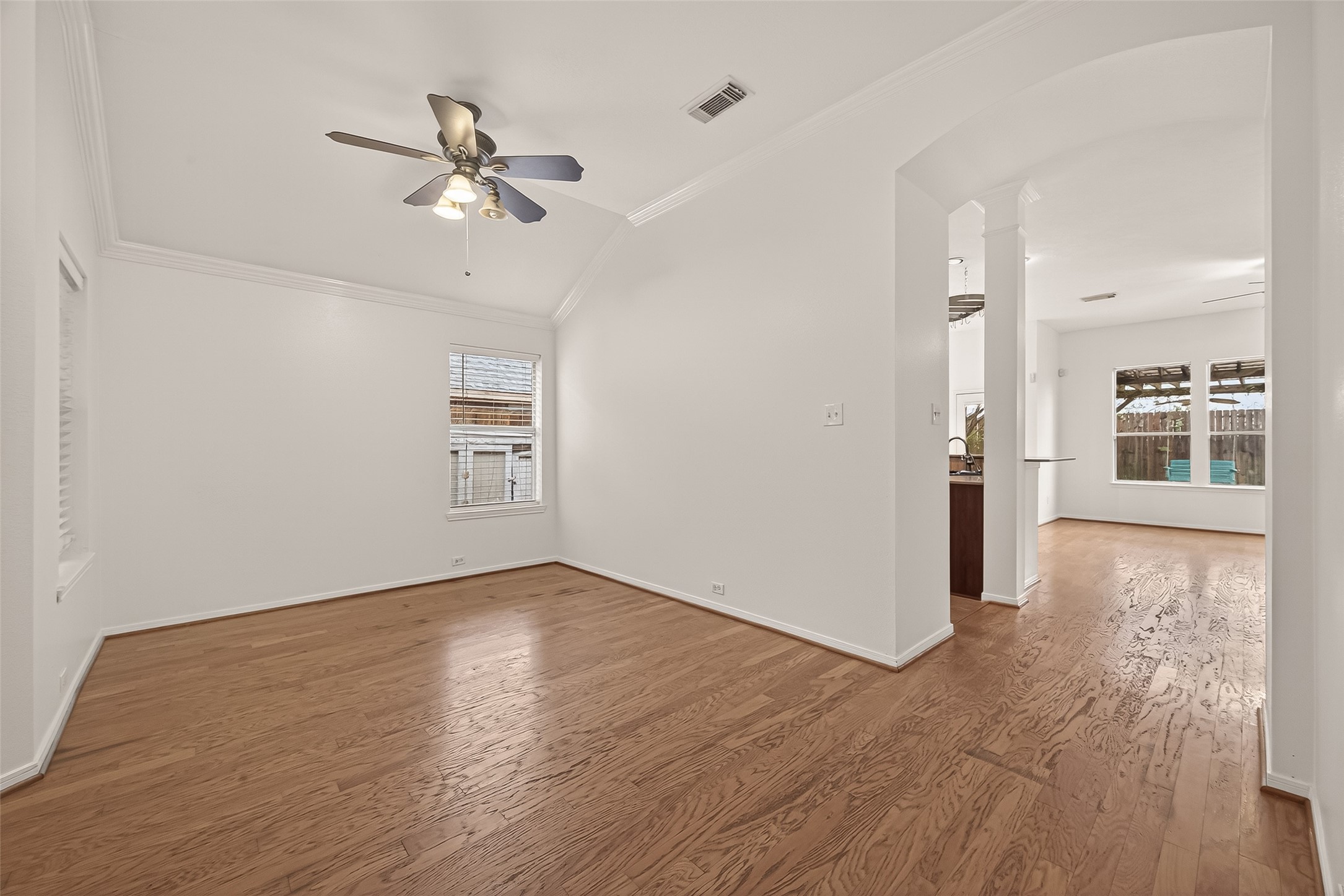 2704 Hewn Rock Way Pearland, TX 77584 - Photo 6 of 40 wooden floor in an empty room with a window