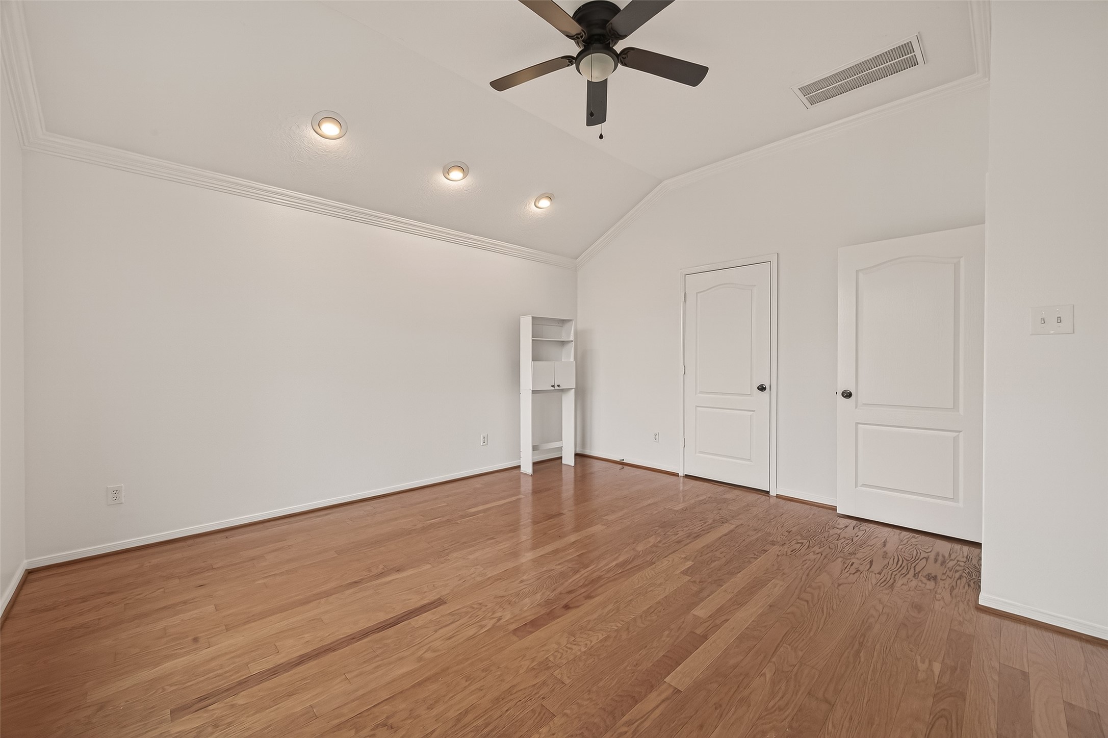 2704 Hewn Rock Way Pearland, TX 77584 - Photo 9 of 40 a view of an empty room with wooden floor