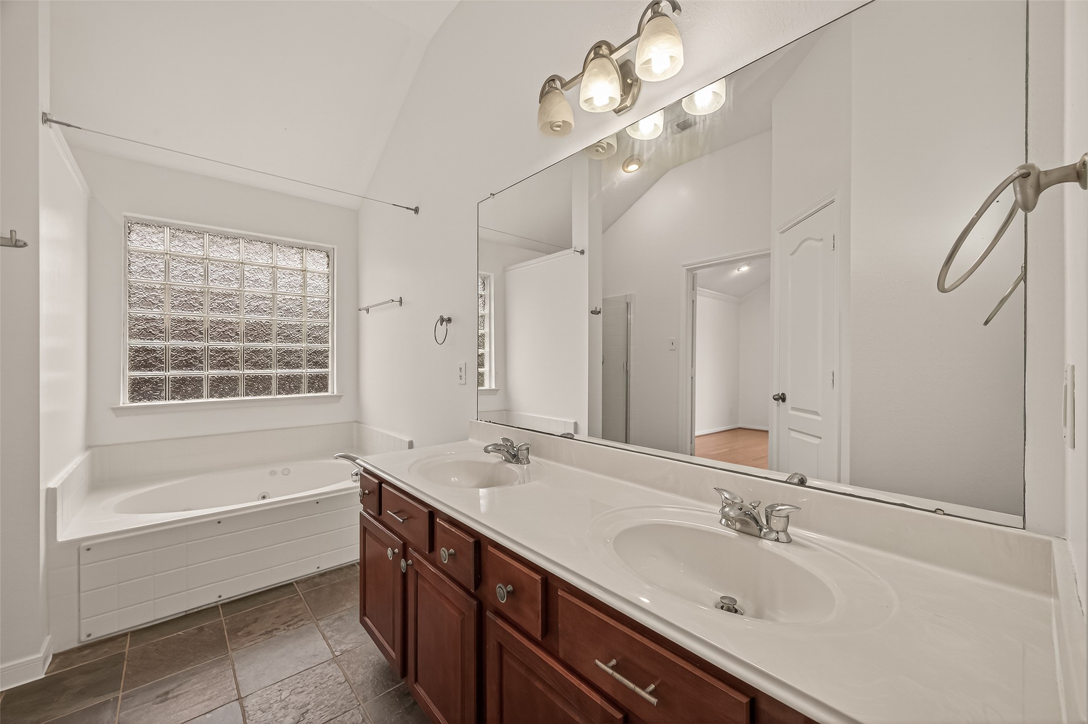 2704 Hewn Rock Way Pearland, TX 77584 - Photo 10 of 40 a spacious bathroom with a tub sink shower and mirror