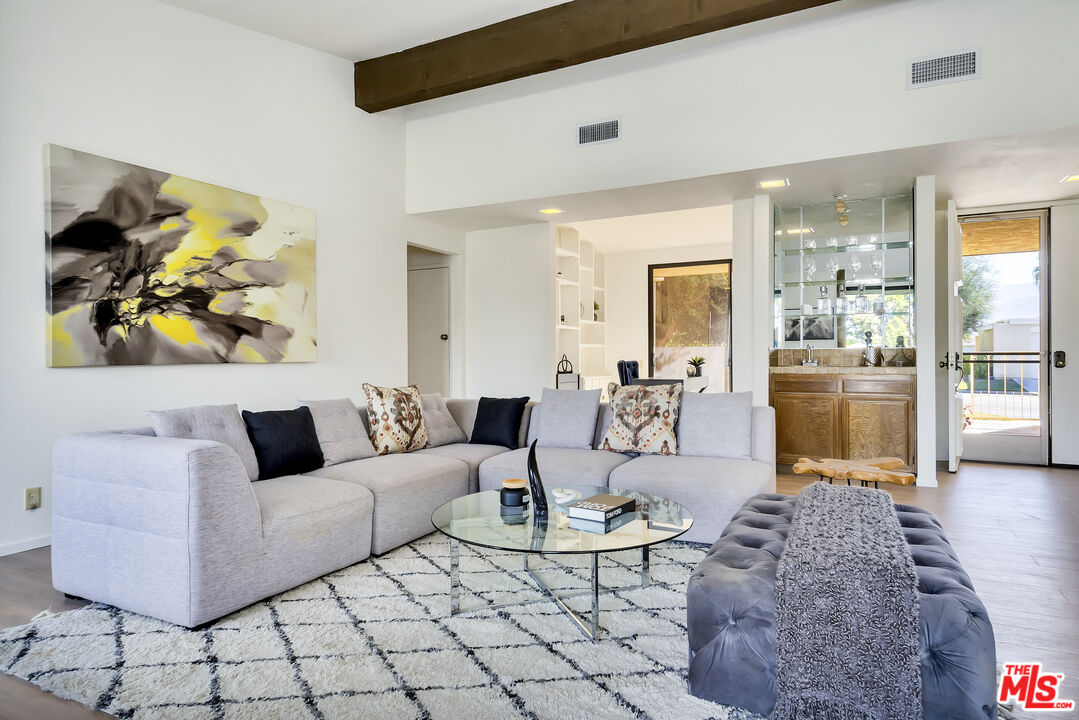 72460 Rodeo Way Rancho Mirage, CA 92270 - Photo 6 of 41 a living room with furniture and a painting on the wall