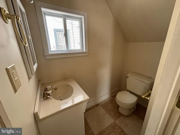 a bathroom with a sink and toilet