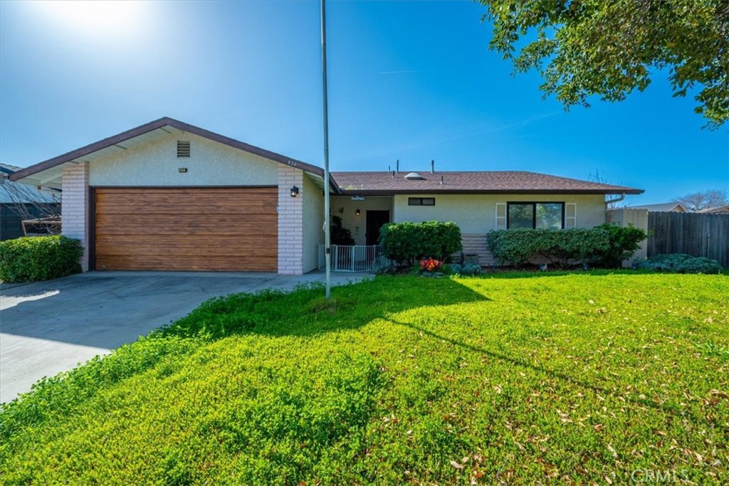 834 Nicklaus Street Paso Robles, CA 93446 - Photo 1 of 37 a front view of a house with garden