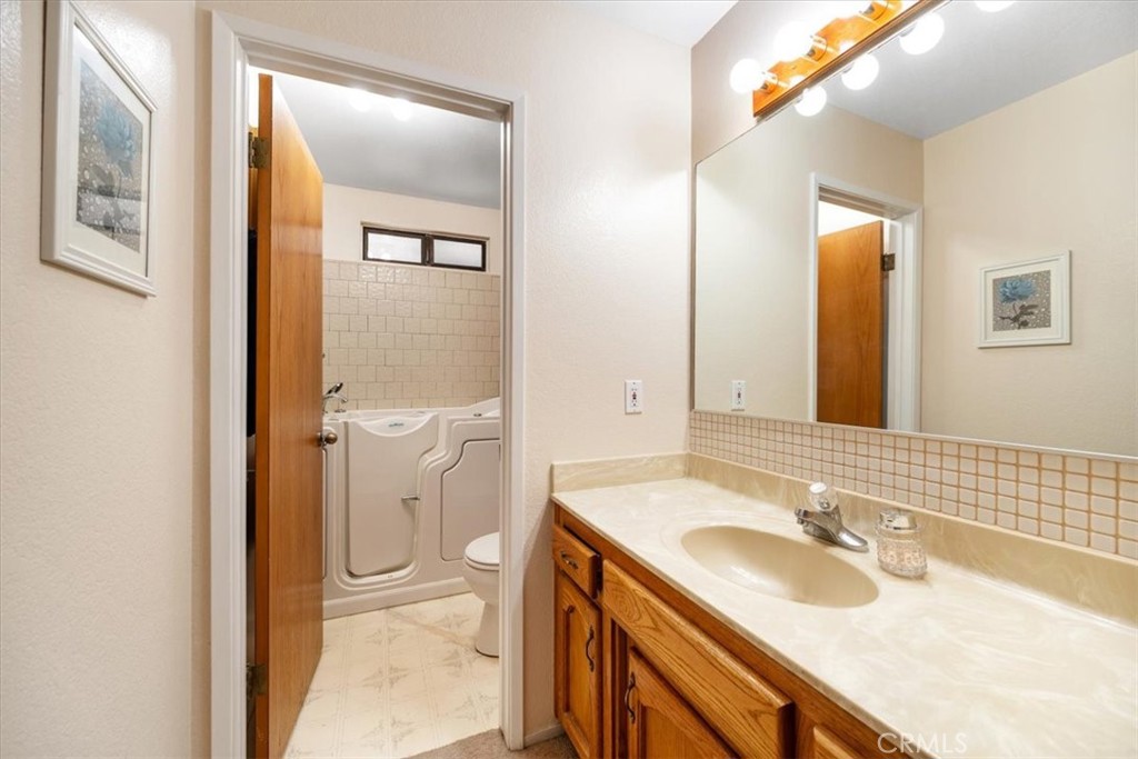 834 Nicklaus Street Paso Robles, CA 93446 - Photo 16 of 37 a bathroom with a sink and a mirror
