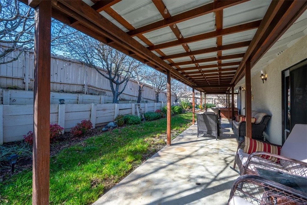 834 Nicklaus Street Paso Robles, CA 93446 - Photo 25 of 37 a view of a porch with a wooden door