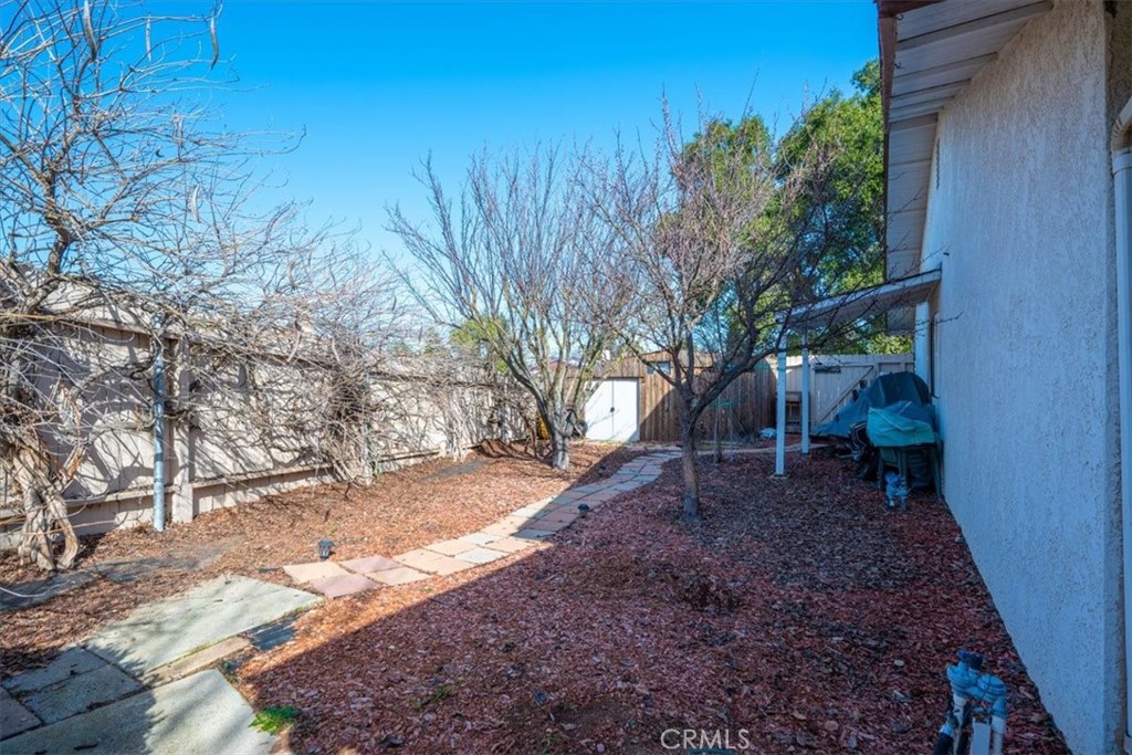 834 Nicklaus Street Paso Robles, CA 93446 - Photo 30 of 37 a view of a backyard with a tree