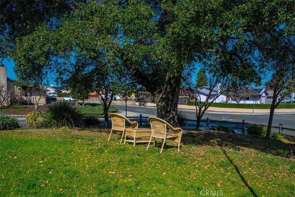 834 Nicklaus Street Paso Robles, CA 93446 - Photo 34 of 37 a white bench sitting in the middle of a park