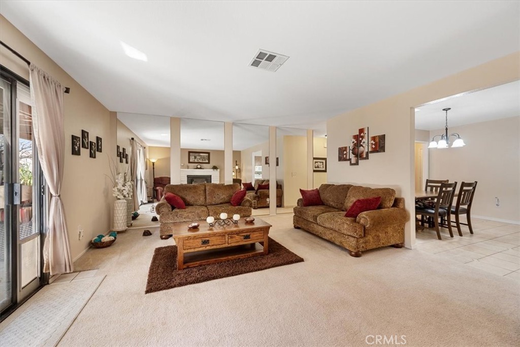 834 Nicklaus Street Paso Robles, CA 93446 - Photo 5 of 37 a living room with furniture white walls and white walls