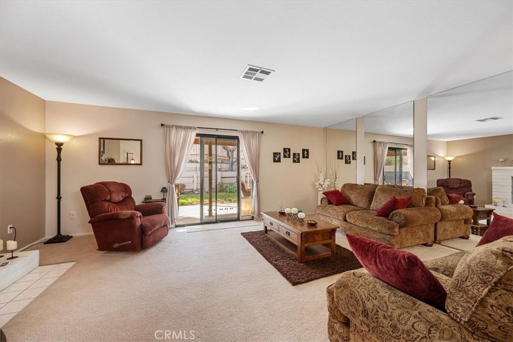 834 Nicklaus Street Paso Robles, CA 93446 - Photo 6 of 37 a living room with furniture and a window