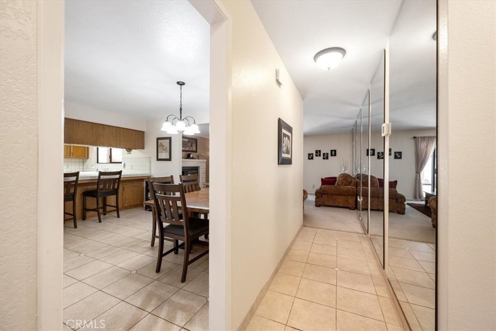 834 Nicklaus Street Paso Robles, CA 93446 - Photo 7 of 37 a lobby with furniture and a dining table with projector