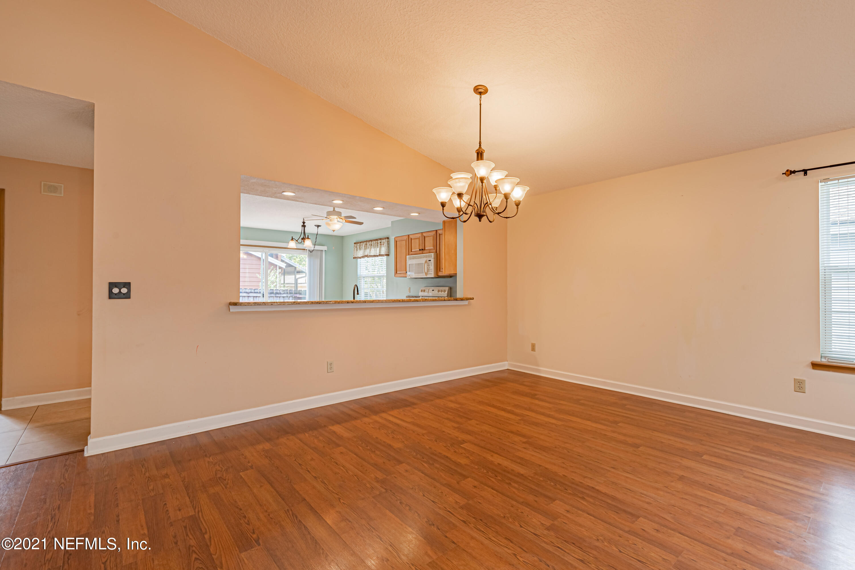 5416 Spring Brook Road Jacksonville, FL 32277 - Photo 11 of 27 a view of an empty room with wooden floor