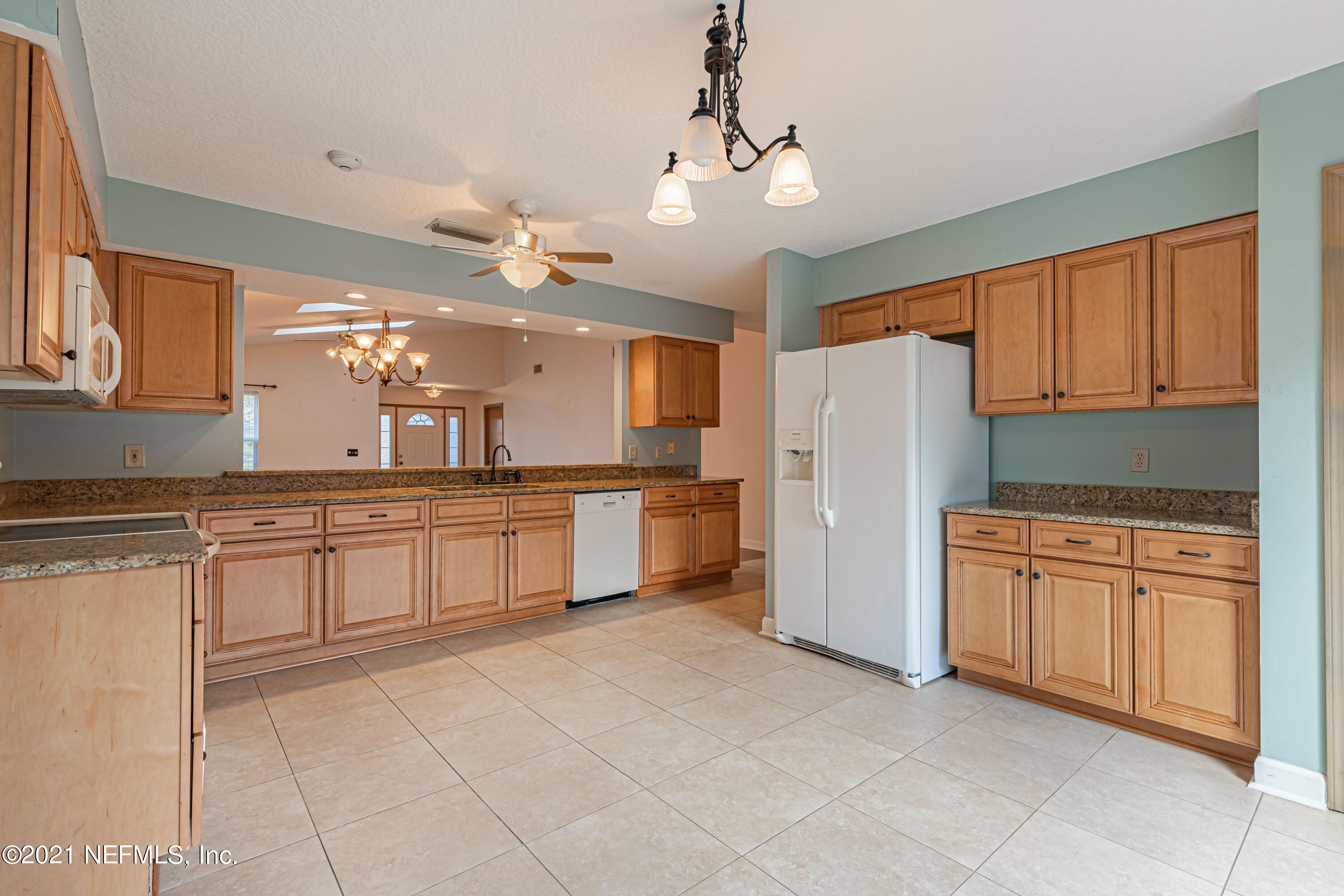 5416 Spring Brook Road Jacksonville, FL 32277 - Photo 15 of 27 a large kitchen with cabinets and stainless steel appliances