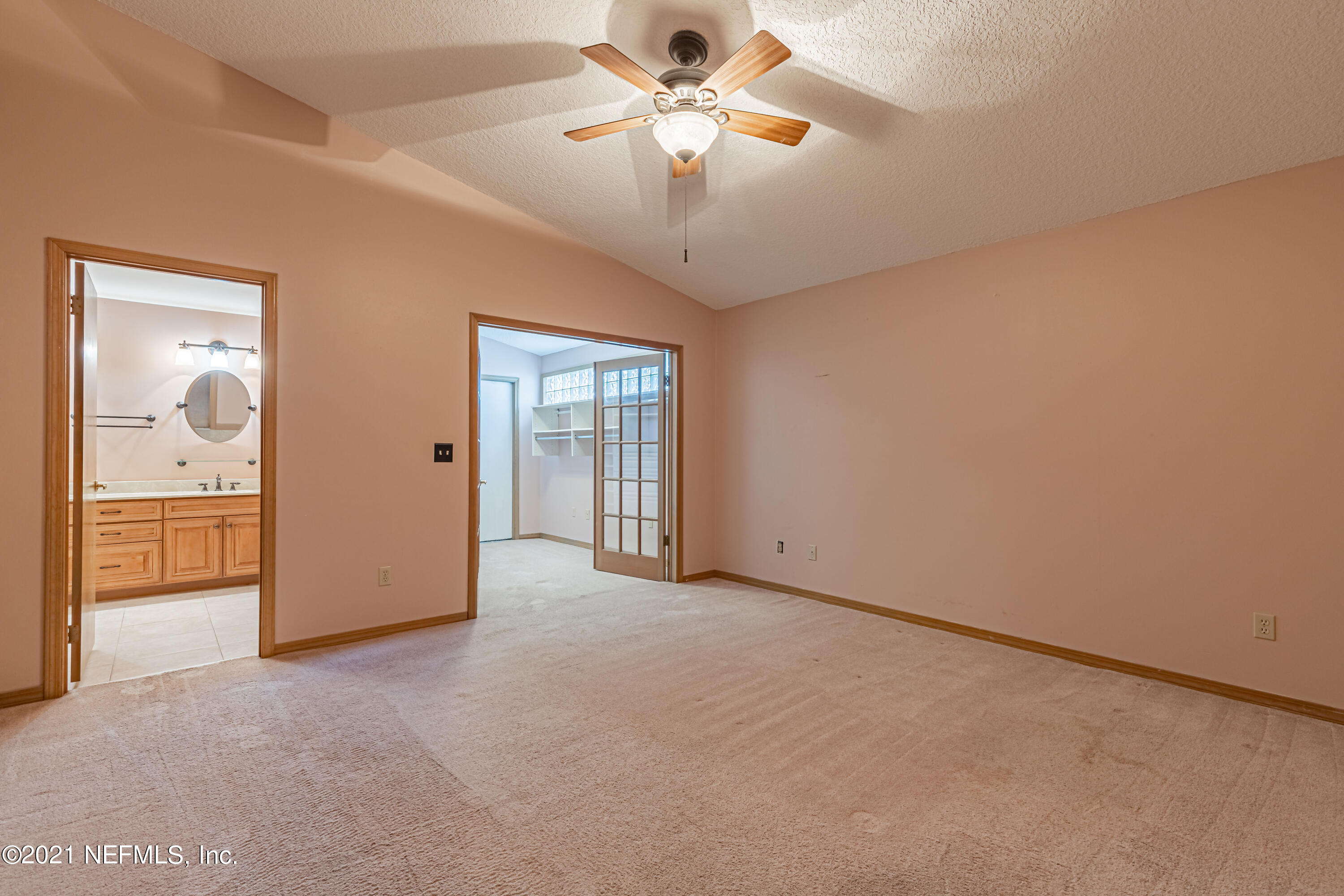 5416 Spring Brook Road Jacksonville, FL 32277 - Photo 16 of 27 an empty room with fan and windows