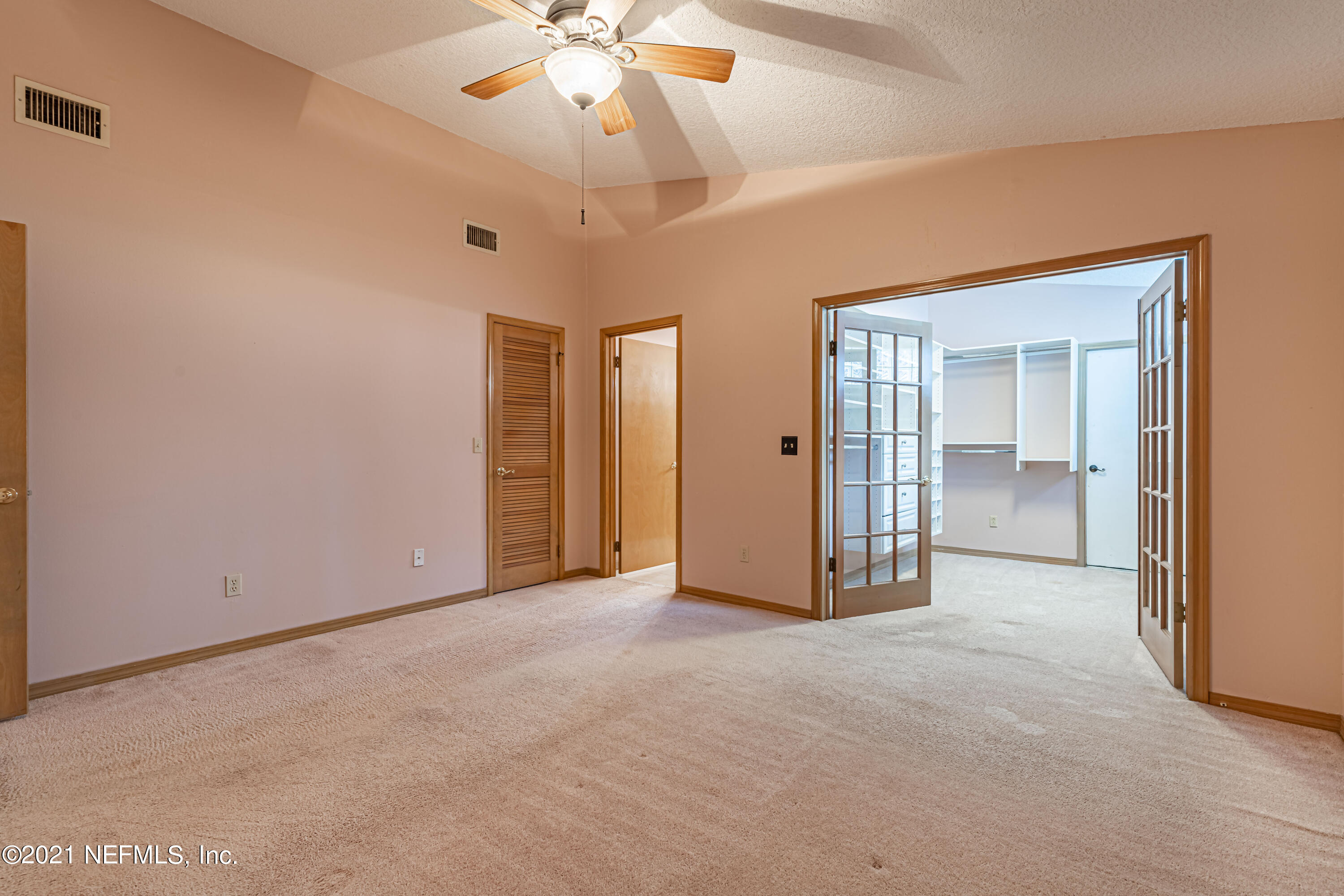 5416 Spring Brook Road Jacksonville, FL 32277 - Photo 17 of 27 a view of empty room with a ceiling fan
