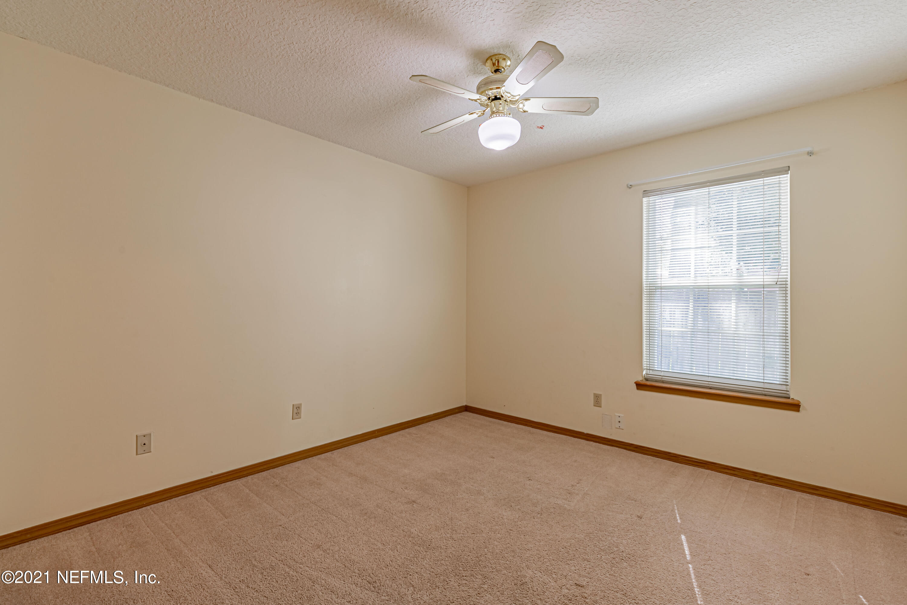 5416 Spring Brook Road Jacksonville, FL 32277 - Photo 22 of 27 an empty room with a window