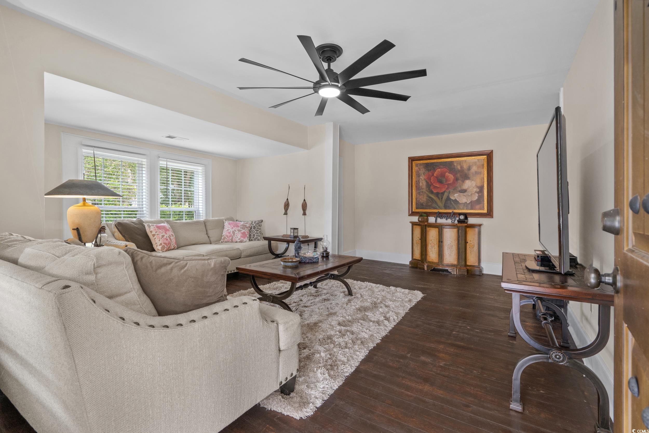 2323 Main Street Loris, SC 29569 - Photo 20 of 40 Living room featuring dark wood-style flooring and ceiling fan