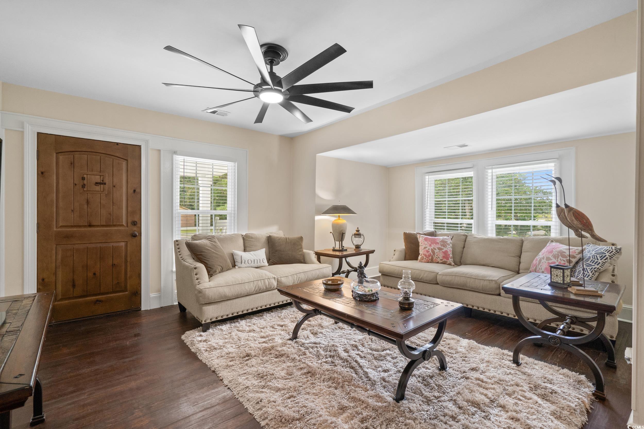 2323 Main Street Loris, SC 29569 - Photo 21 of 40 Living area featuring dark wood-style flooring and a ceiling fan