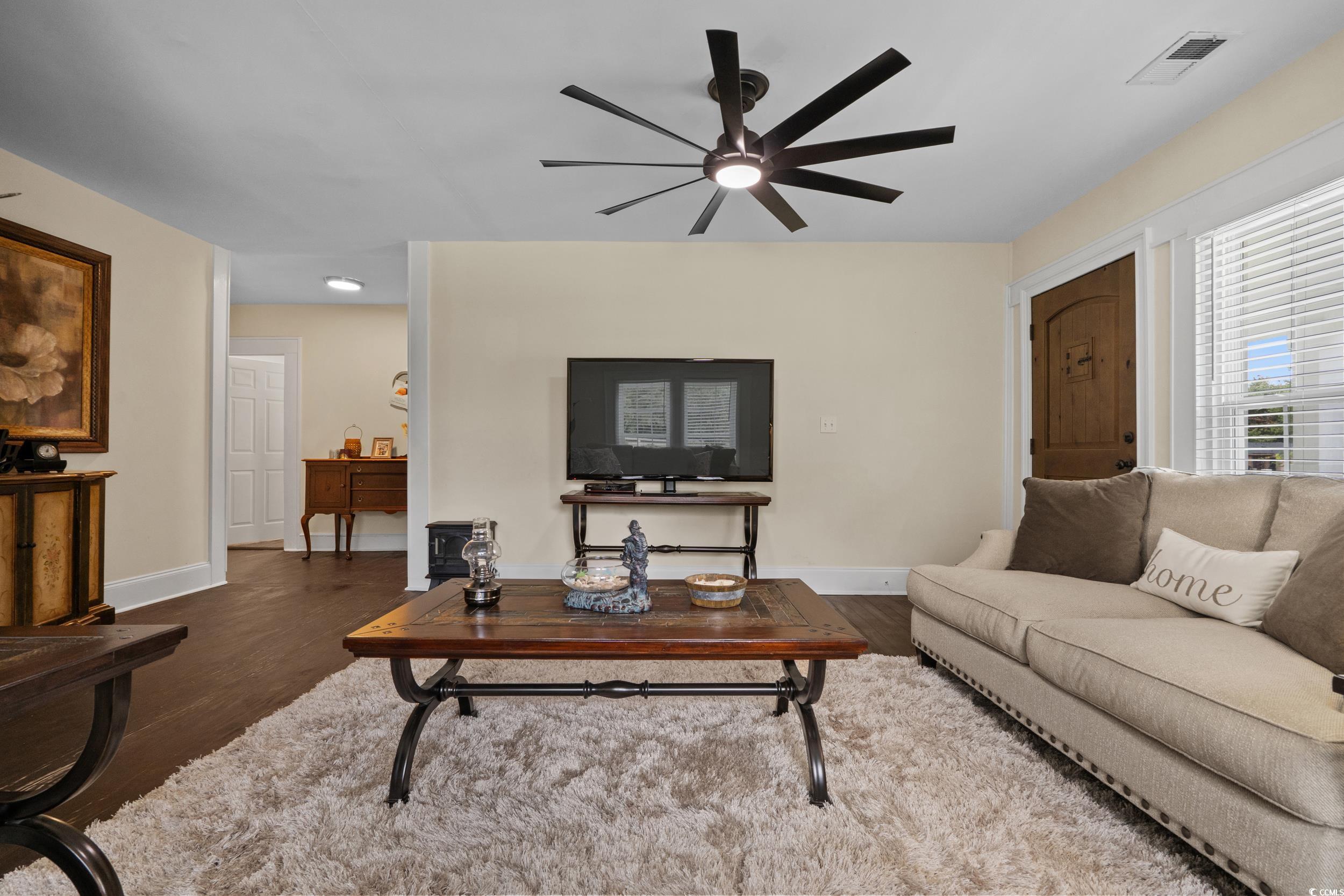 2323 Main Street Loris, SC 29569 - Photo 23 of 40 Living area with wood finished floors and ceiling fan