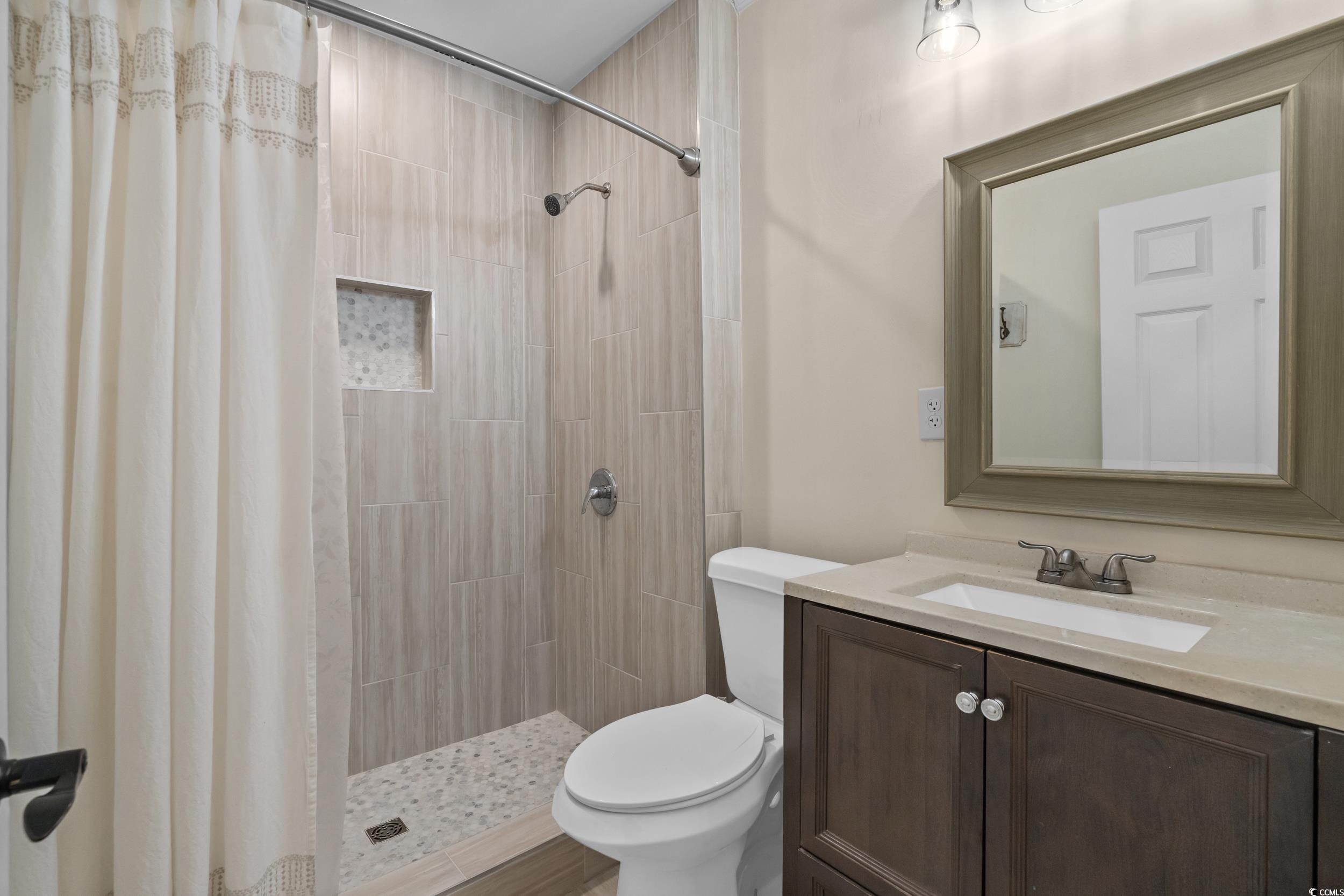 2323 Main Street Loris, SC 29569 - Photo 32 of 40 Bathroom featuring vanity and tiled shower