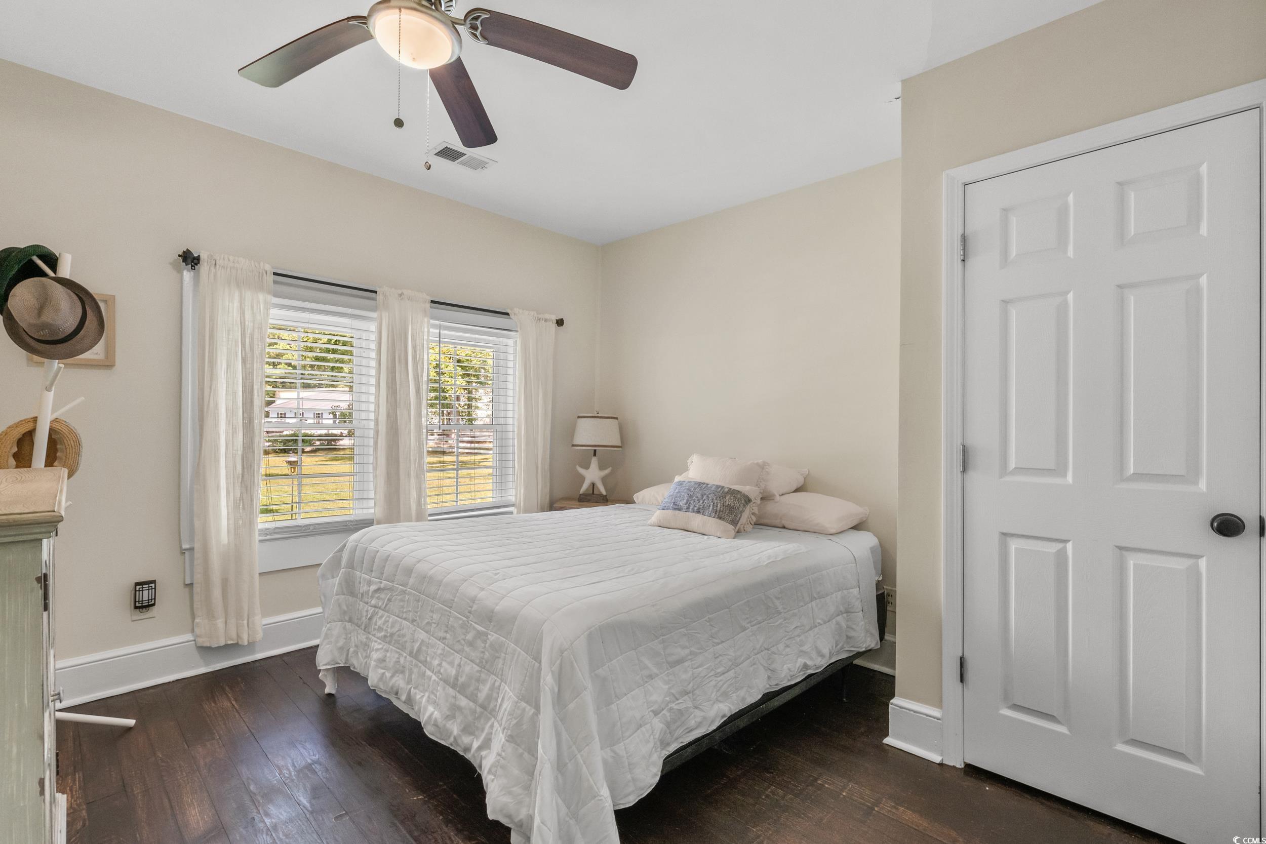 2323 Main Street Loris, SC 29569 - Photo 33 of 40 Bedroom with dark wood-style floors and ceiling fan
