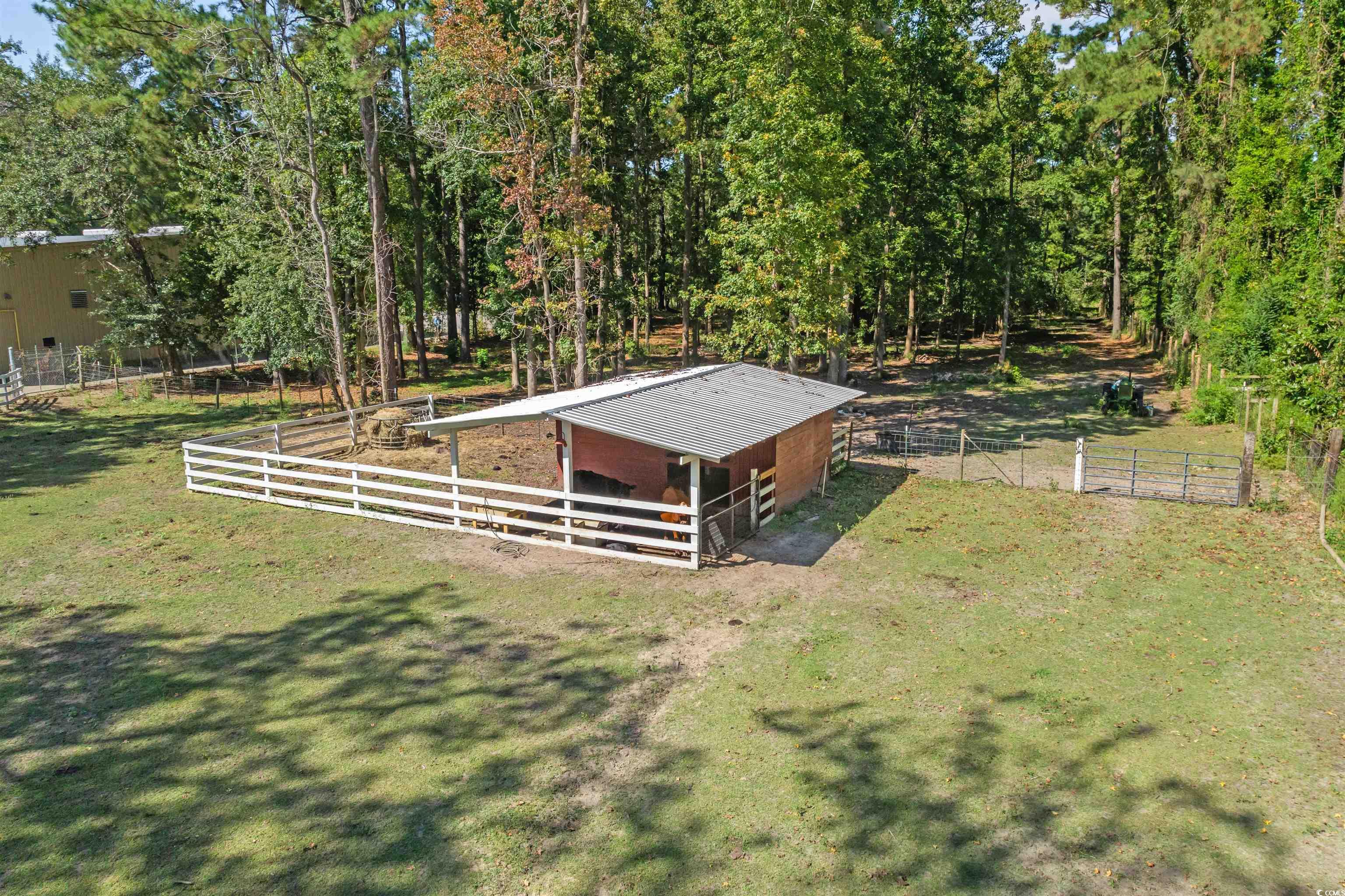 2323 Main Street Loris, SC 29569 - Photo 40 of 40 View of yard featuring an exterior structure, an outbuilding, and a view of rural / pastoral area