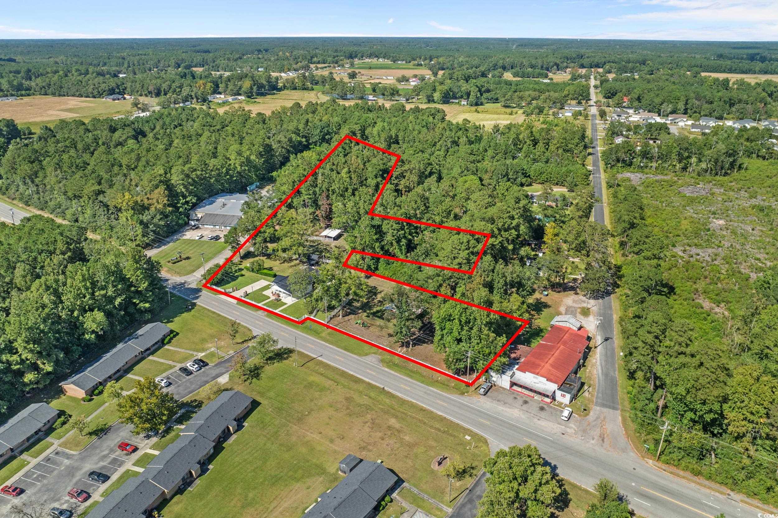 2323 Main Street Loris, SC 29569 - Photo 5 of 40 View of property location featuring property parcel outlined and a heavily wooded area